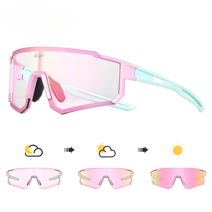 Pink and blue sunglasses with interchangeable lenses on a white background