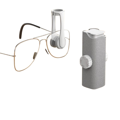 Eyeglasses and a white and gray electronic device on a white background