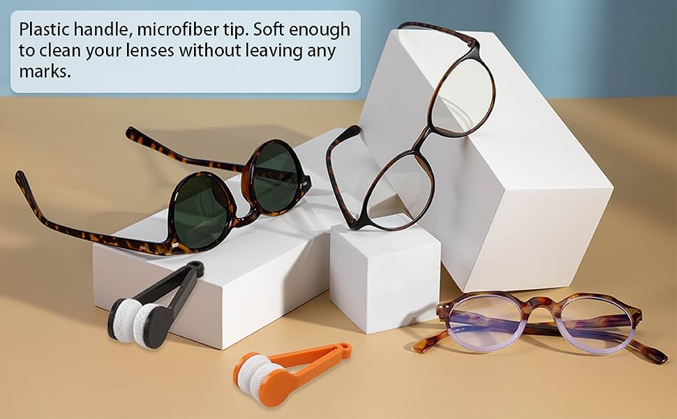 Eyeglasses with cleaning tools on a beige surface